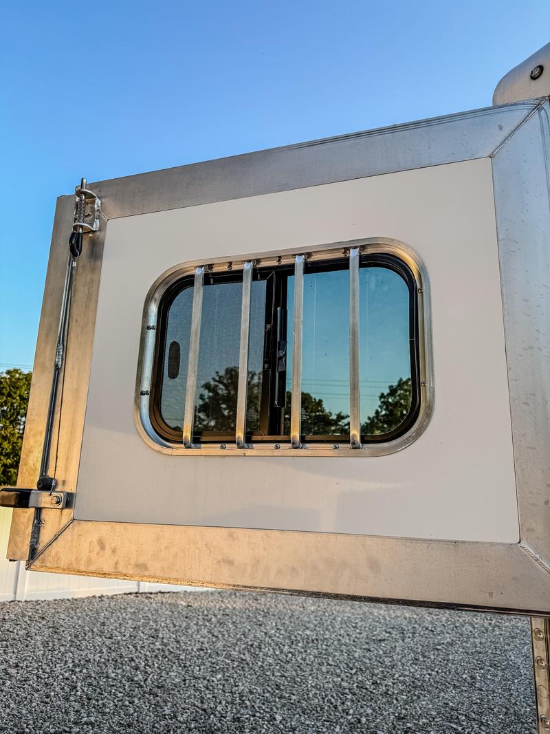 Rear sliding window with protective bars